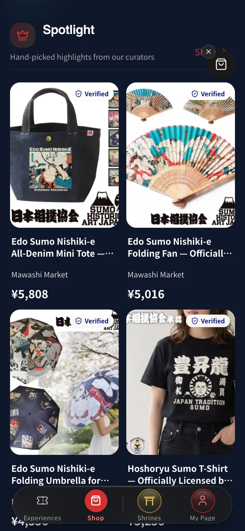 Matsuri shop Spotlight rail with a sumo woodblock-print denim tote, a folding fan, a folding umbrella and a sumo T-shirt, each with a price in yen