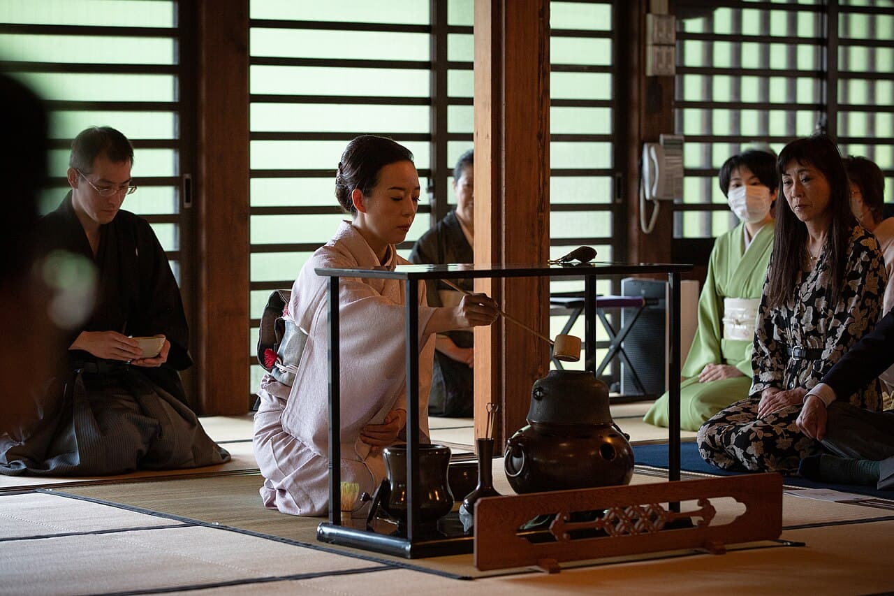 A tea master serving a traditional matcha tea ceremony at Gokokuji Temple in Tokyo