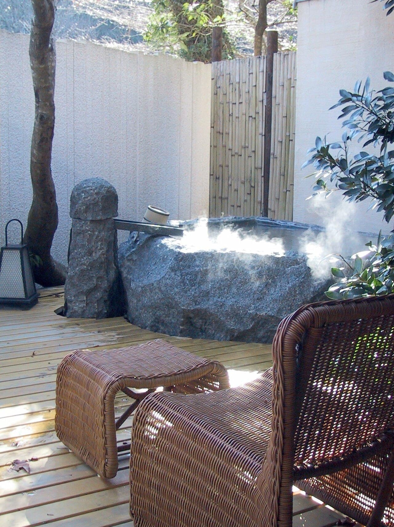 A private open-air onsen bath (rotenburo) at a traditional ryokan in Hakone