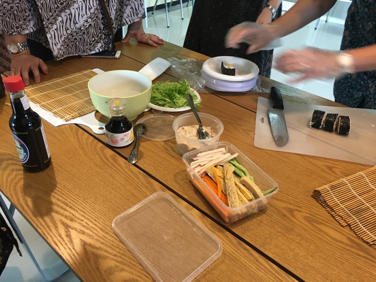 Sushi being made by hand — a hands-on sushi-making session